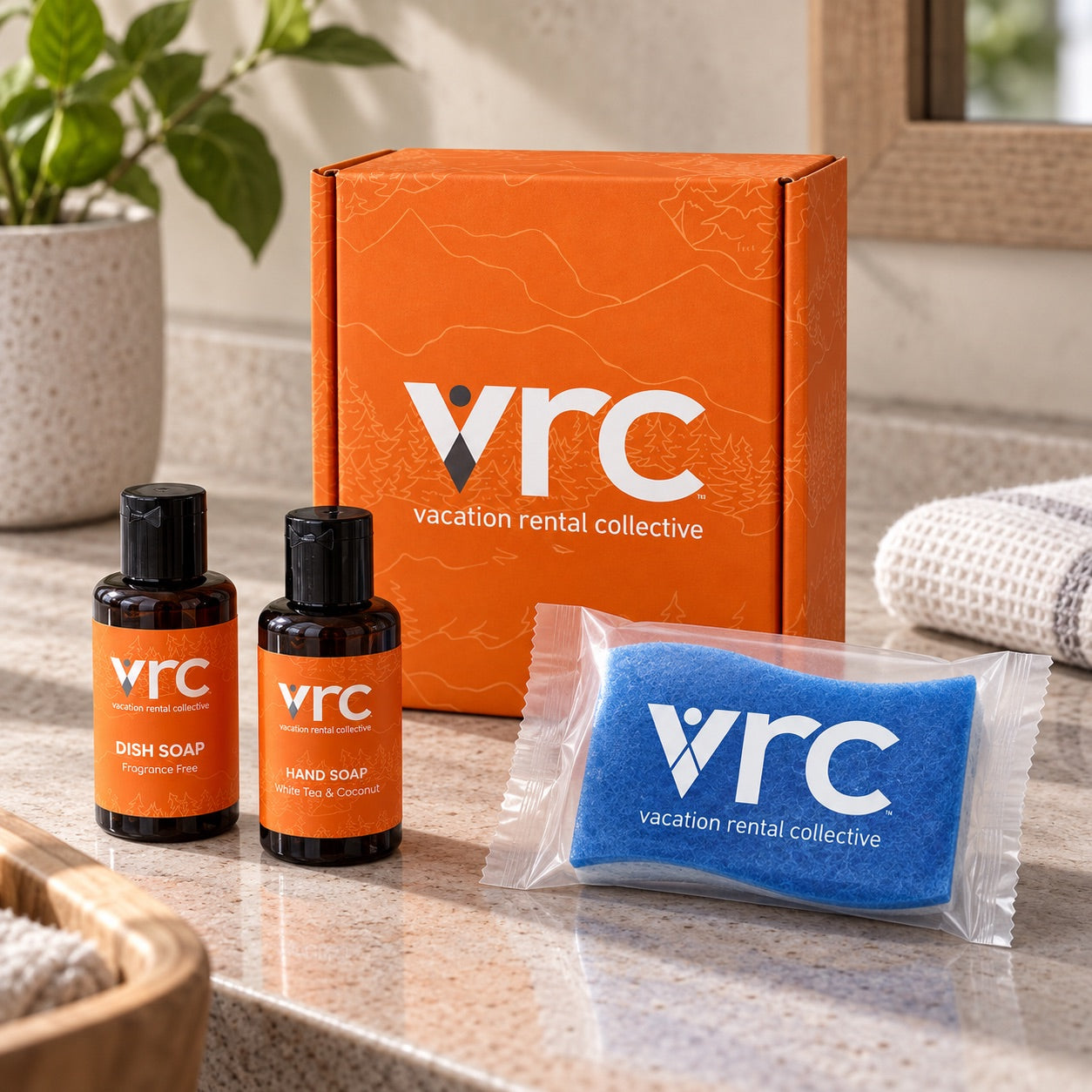 Vacation Rental Collective branded kit with dish soap, hand soap and a sponge