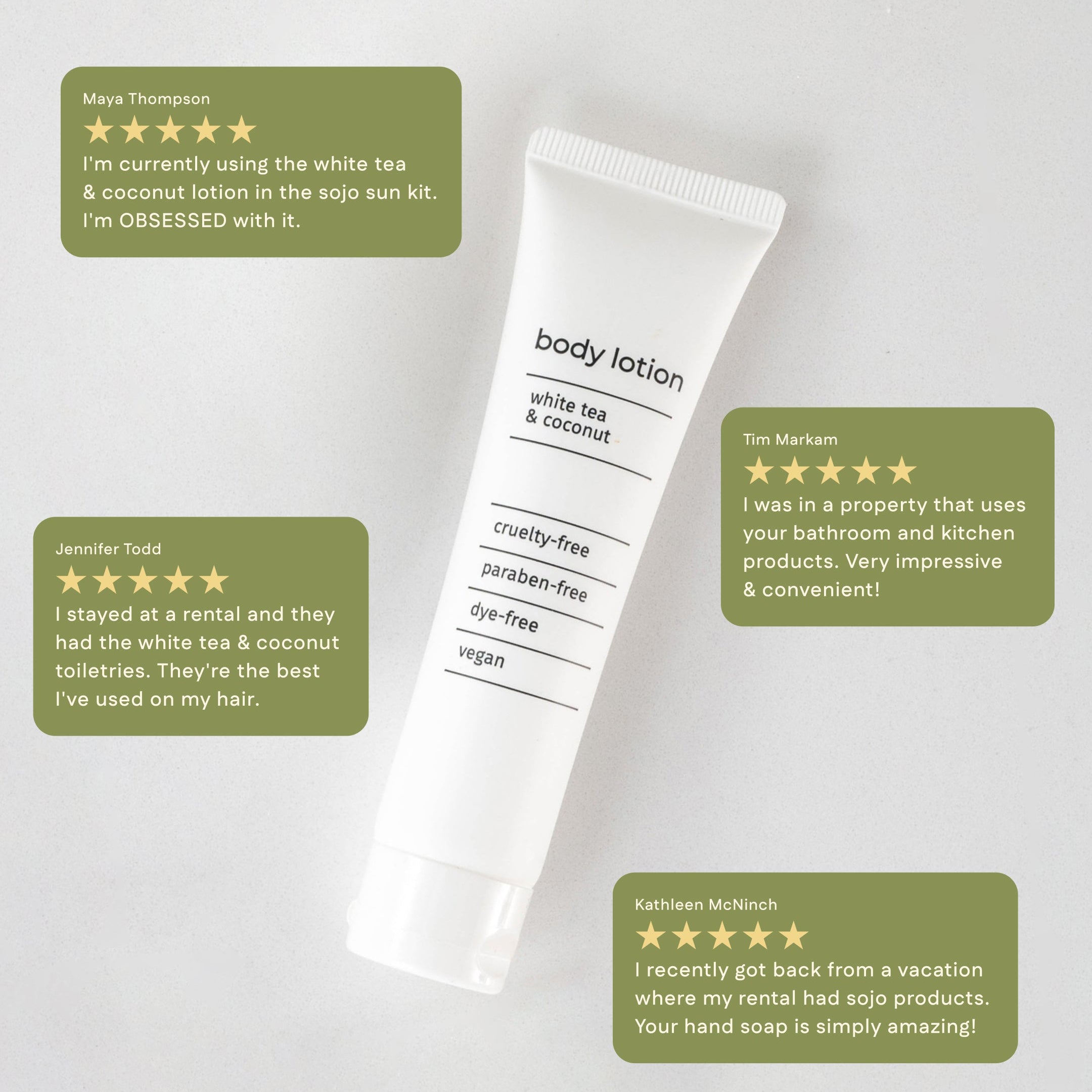 sojo's Sun Kit on top of shelf with a vase with daises