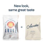 Two bags of sojo's coffee Awake blend shown side by side with the text 'New look, same great taste.' The left bag is white with a colorful sunburst logo and the word 'AWAKE'; the right bag is a plain warm off-white with the word 'Awake' in dark blue script.