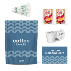 sojo coffee bundle kit featuring a blue pouch, four Eco Stick sugar sticks, two Coffee-Mate creamer packets, two of sojo's Awake coffee blend k-cups, and a custom blue welcome card.