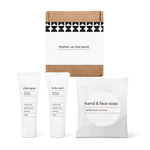 Full bath amenity essentials kit featuring shampoo, body wash, and hand and face soap in a box.
