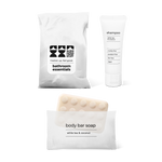Lite bathroom essentials kit with shampoo and body bar soap in a bag.