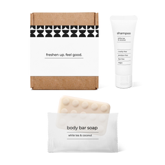 Full bath amenity essentials kit with shampoo and body bar soap in a box.