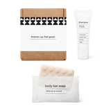 Full bath amenity essentials kit with shampoo and body bar soap in a box.