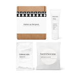 Luxury half bath amenity kit featuring hand and face soap, makeup wipe, and body lotion in a box.