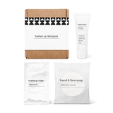 Luxury half bath amenity kit featuring hand and face soap, makeup wipe, and body lotion in a box.