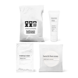 Luxury half bath amenity kit featuring hand and face soap, makeup wipe, and body lotion in a bag.