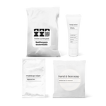 Luxury half bath amenity kit featuring hand and face soap, makeup wipe, and body lotion in a bag.