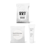 Half bath essentials kit with hand and face soap and body lotion in a bag.