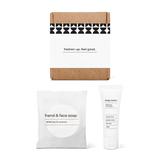 Half bath essentials kit with hand and face soap and body lotion in a box.