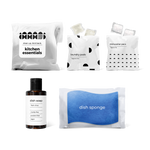 kitchen essentials kit featuring fresh citrus-scented dish soap, dish sponge, laundry pods, and dishwasher pacs in a bag.