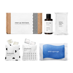 kitchen essentials kit including fresh citrus-scented dish soap, dish sponge, laundry pods, dishwasher pacs, and kitchen cleaning wipes in a box.