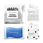 Kitchen essentials kit with dish sponge, dishwasher pacs, and laundry pods in a bag.