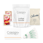 Casago coffee bundle with two Coffeemate powdered creamers, four sticks of granulated white sugar, a bag of sojo's Awake ground coffee blend, and a welcome card