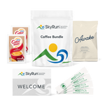 SkyRun coffee bundle with two Coffeemate powdered creamers, four sticks of granulated white sugar, a bag of sojo's Awake ground coffee blend, and a welcome card