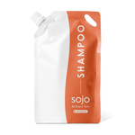 1 liter white and orange refill pouch of shampoo 