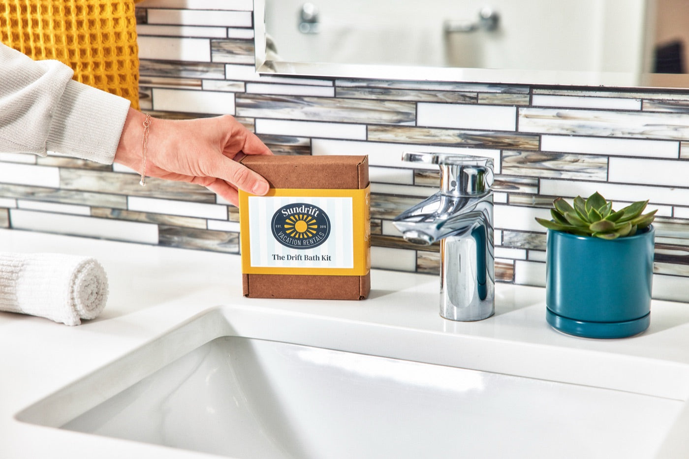 Custom-branded bath kit placed on a bathroom counter